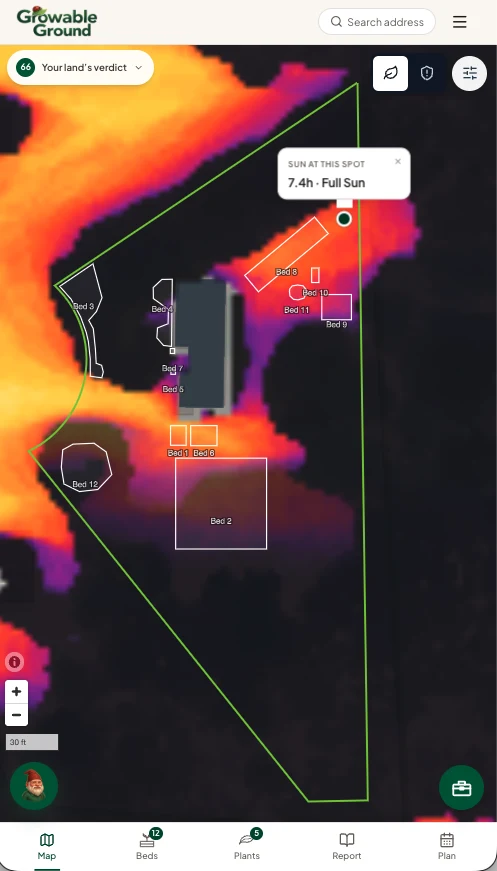 A phone screenshot of the garden map showing the sun-hours raster, tree canopy, the parcel line, twelve uniquely labelled garden beds (Bed 1 through Bed 12), a tap-a-spot card reading "SUN AT THIS SPOT · 7.4h · Full Sun", the site verdict pill (66), and a 30 ft scale bar.